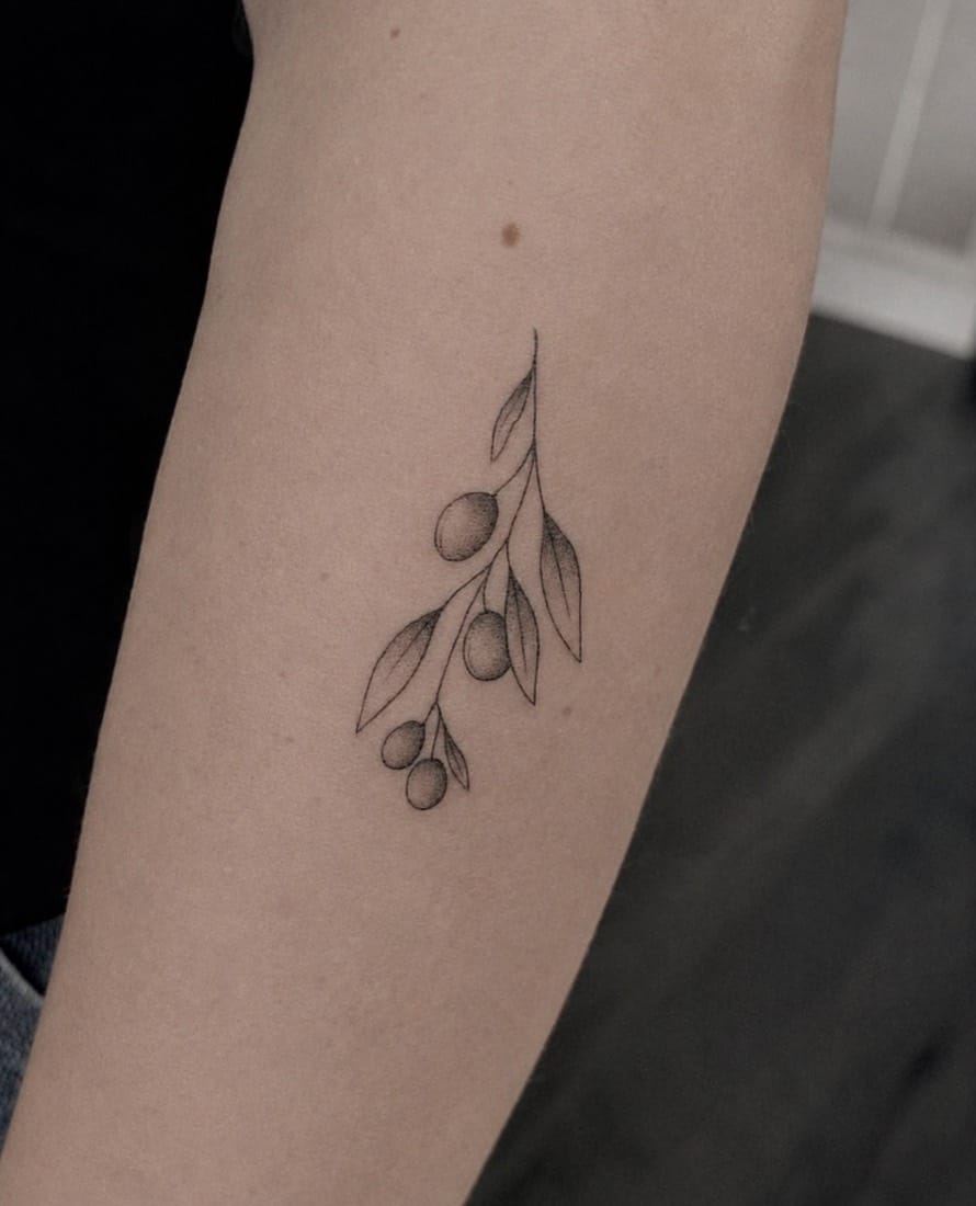 Fine line olive branch tattoo by a London Fine Line Tattoo Academy student