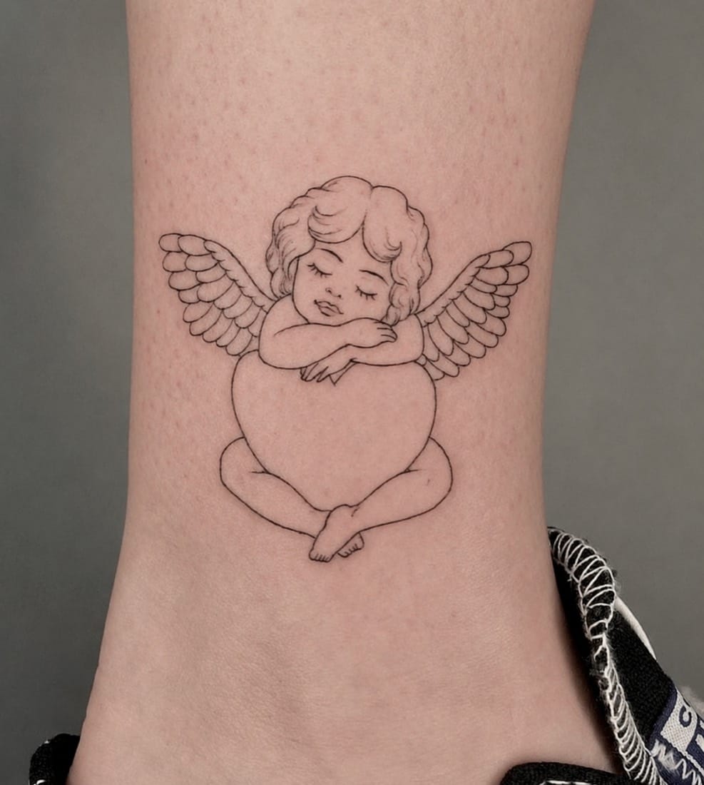 Fine line cherub angel tattoo by a London Fine Line Tattoo Academy student
