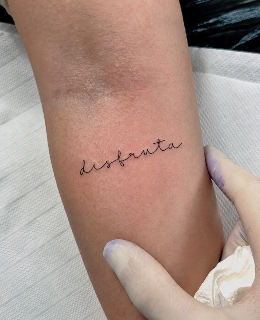 Fine line cursive script lettering tattoo by a London Fine Line Tattoo Academy student